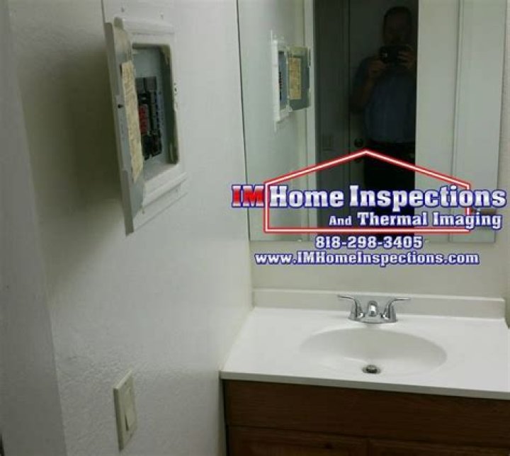 Can an electrical panel be in a bathroom?