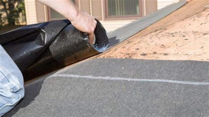 Can you put rolled roofing over shingles?