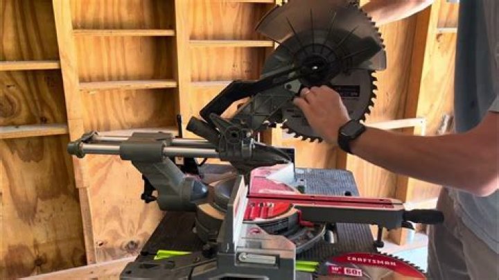 How do I change the blade on my Craftsman miter saw?