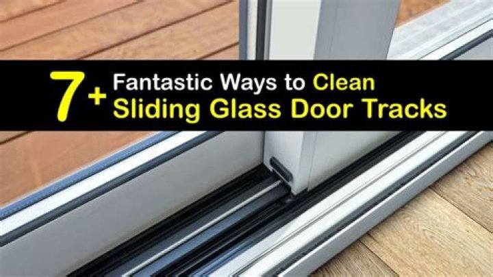 How do I clean a sliding glass door track?