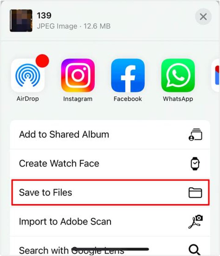 How do I save multiple pictures from a text message on my iPhone?