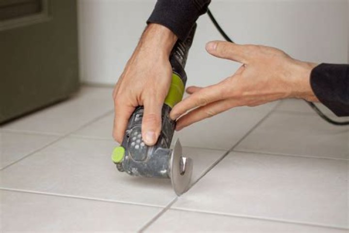 How do I scrape grout?