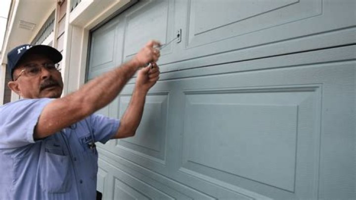 How do you change the gears on a garage door?