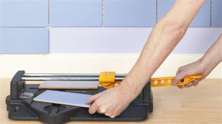 How do you cut glass wall tile?