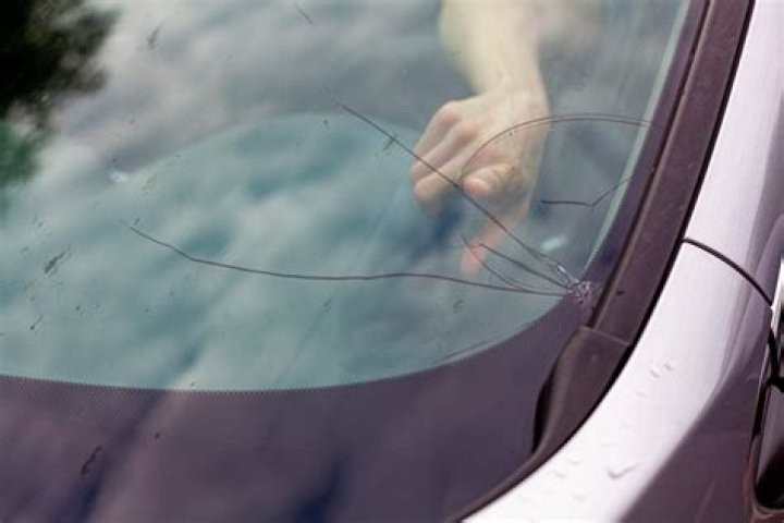 How do you fix a cracked windshield with bug spray?
