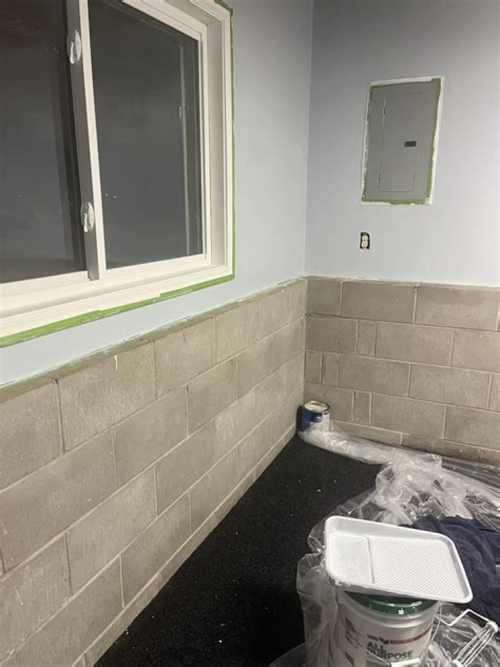 How do you paint a basement block wall?