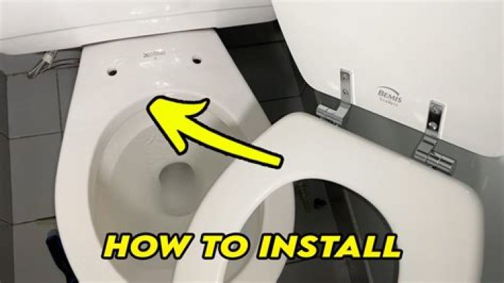 How do you remove a metal hinge from a toilet seat?