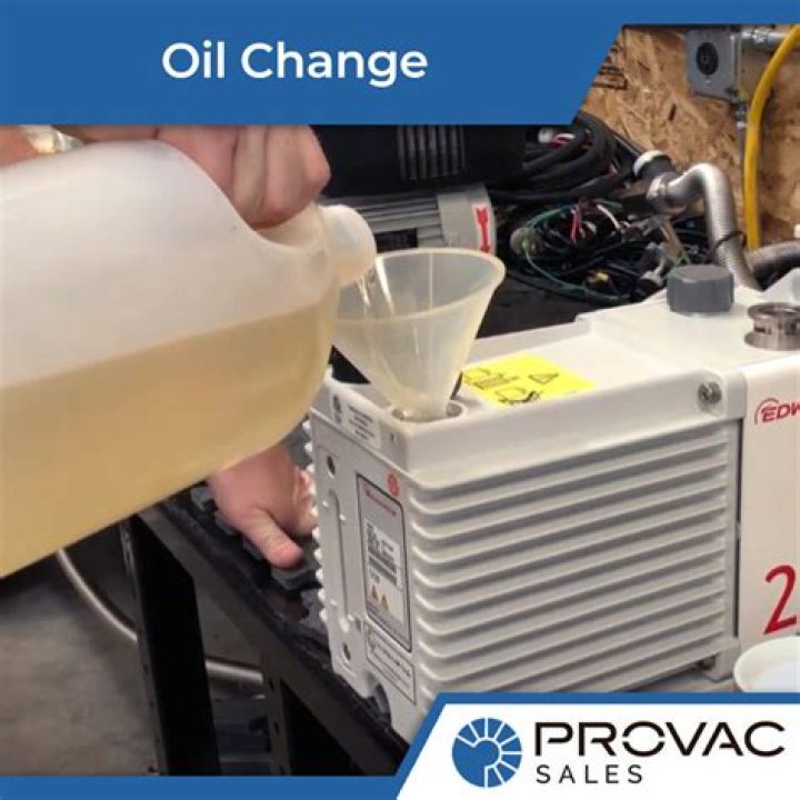 How often should the vacuum pump oil be changed?