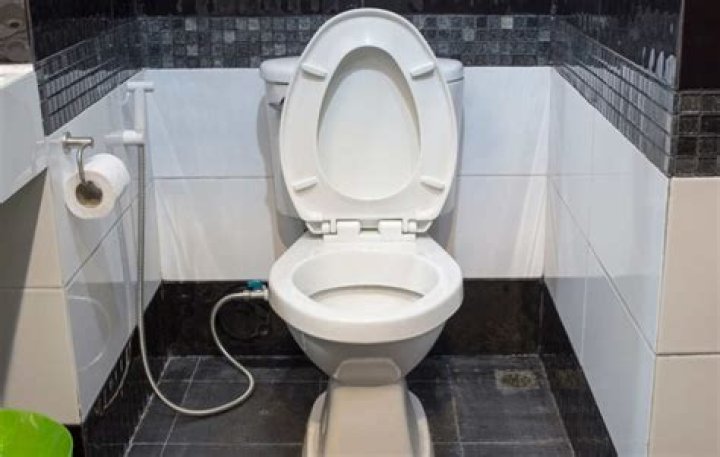 Should you tile under or around a toilet?