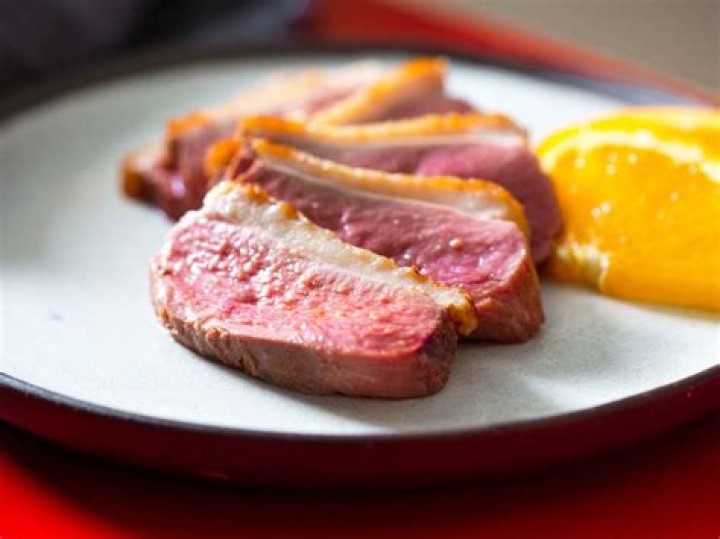 What temperature should duck be cooked to?