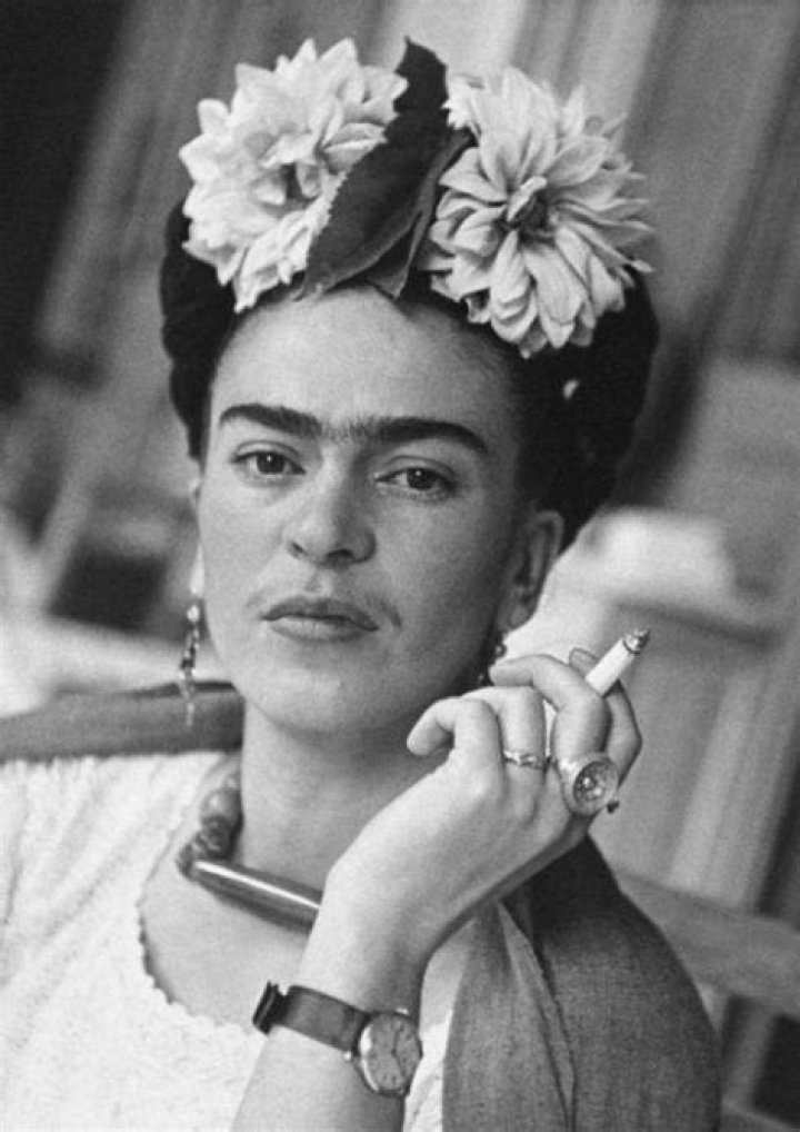Why did Frida Kahlo paint herself with a unibrow and mustache?