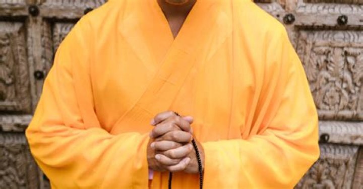Why do monks wear yellow robes?