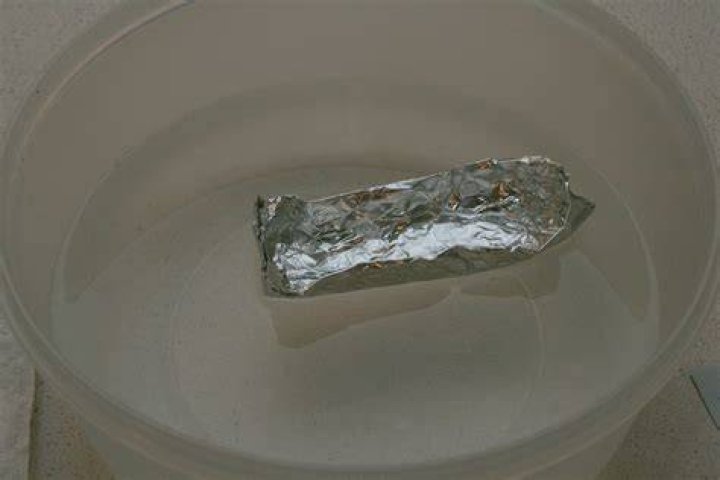 Why does an aluminum foil boat float?
